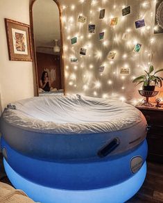 an inflatable bed with lights on the wall