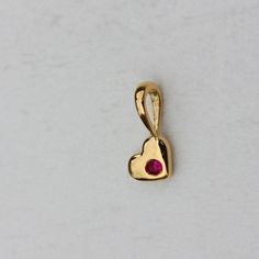 ⚫ This charm made in 14k solid yellow gold with genuine ruby gemstone,⚫ 14k Yellow Gold Gemstone Charm Heart Pendant Fine Jewelry.⚫ Heart Pendant, 14k Gold Pendant, Ruby Jewelry, Everyday Jewelry⚫ Special customize for Mother's day, Anniversary, Birthday Gift, Valentine, Christmas. ⚫ Item Details:14k Gold Weight: 0.22 GMItem Size: 8 x 4 MMSKU: CDFJP-0145Gemstone color may vary due to natural and availability.This is a made to order design. Please allow 7-10 days as manufacturing time⚫ About USWe Valentine's Day Yellow Gold Birthstone Necklace, Heart-shaped Yellow Gold Birthstone Necklace, Heart Cut Birthstone Necklace In Yellow Gold, Heart-shaped Yellow Gold Birthstone Necklace For Valentine's Day, Valentine's Day Heart Shaped Yellow Gold Birthstone Necklace, Dainty 14k Gold Heart Pendant Birthstone Necklace, 14k Gold Birthstone Necklace For Valentine's Day, Gold Heart-shaped 14k Gold Birthstone Necklace, Yellow Gold Birthstone Pendant Necklace For Valentine's Day