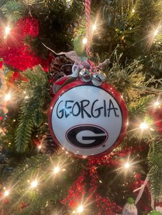 a christmas ornament hanging from the side of a tree