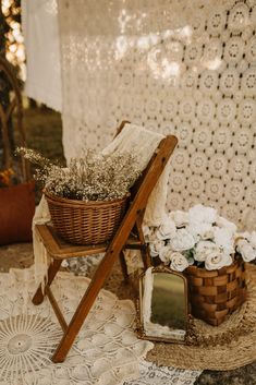 a wooden chair sitting next to a basket filled with flowers