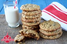 a stack of cookies next to a glass of milk