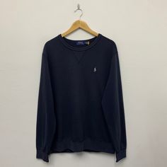 >> Polo RL Sweatshirt ** Size on tag : Large ** Measurement on laid flat :  >> Armpit : 24" >> Shoulder to bottom : 29" >> Length sleeve from collar : 32" ** Good used condition. ** No holes or stains. ** Overall condition is 8/10 ** Weight : 480g Blue Casual T-shirt With Ribbed Collar, Navy Cotton Crew Neck Sweater, Casual Crew Top With Ribbed Collar, Navy Long Sleeve Sweatshirt, Casual Crew Neck Top With Ribbed Collar, Casual Blue Tops With Ribbed Collar, Casual Tops With Ribbed Crew Neck, Casual Blue Top With Ribbed Collar, Classic Crew Neck Plain Sweater