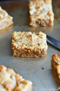 several squares of food sitting on top of a pan