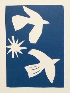 three white birds flying in the air above blue and white paper with stars on it