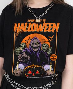 Stay spooky every day with our 'Everyday is Halloween' Unisex Tee! Featuring a zombie design, this t-shirt is perfect for horror fans and Halloween enthusiasts. Made with high-quality material, it's comfortable for everyday wear. Embrace your love for all things spooky with this unique and stylish tee. . Everyday is Halloween. 100% combed ringspun cotton· Light fabric· Premium fit· Runs bigger than usual· Original design Care Instructions: Machine wash cold. Do not bleach. Tumble dry low. Halloween Horror Skull Print T-shirt, Halloween Horror T-shirt With Screen Print, Horror Halloween T-shirt With Screen Print, Spooky Halloween T-shirt For Streetwear, Gothic Halloween T-shirt With Letter Print, Black Horror T-shirt With Letter Print, Black Horror T-shirt With Skull Print, Horror Black T-shirt With Skull Print, Zombie Design