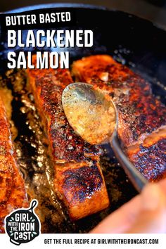 someone is cooking salmon in a skillet with a spoon on the side and text that reads, butter based blackened salmon salmon