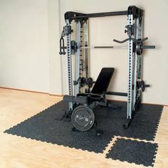 a gym equipment set up in the middle of a room