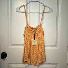 Perfect For Late Summer! Gold/Yellow Gingham Tank With Adjustable Spaghetti Strap And Ruffled Neckline. Length Is Like A Longer Crop. Live Your Best Americana Life! Gingham Tops For Beach In Spring, Yellow Gingham, Ruffled Neckline, Late Summer, Gold Yellow, Orange Yellow, Gingham, Spaghetti Strap, Spaghetti