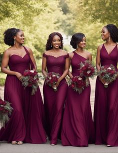 the bridesmaids are all dressed in burgundy dresses