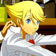 an anime character with blonde hair and blue eyes, wearing a white shirt in front of a desk