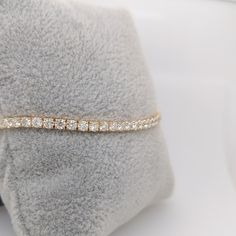 A stunning natural diamond tennis bracelet in 14k yellow gold. This classic design never goes out of style, make your statement with this string of sparkling diamonds, a perfect gift for yourself or someone you love. This bracelet has a secure clasp for worry free wear! Yellow Gold Cubic Zirconia Tennis Bracelet For Everyday Luxury, Fine Jewelry Yellow Gold Tennis Bracelet With Cubic Zirconia, Dazzling Gold Tennis Bracelet With Brilliant Cut, Yellow Gold Tennis Bracelet With Cubic Zirconia Round Cut, Yellow Gold Cubic Zirconia Tennis Bracelet With Round Cut, Yellow Gold Tennis Bracelet With Cubic Zirconia, Elegant White 14k Gold Tennis Bracelet, Yellow Gold Cubic Zirconia Tennis Bracelet, Dazzling Yellow Gold Tennis Bracelet As Gift