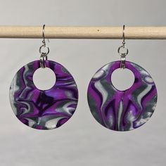 Handmade, one-of-a-kind polymer clay earrings with nickel-free findings Nickel-free Silver Resin Earrings, Trendy Nickel-free Purple Earrings, Handmade Purple Polymer Clay Earrings, Purple Dangle Polymer Clay Jewelry, Unique Purple Polymer Clay Earrings, Nickel-free Polymer Clay Dangle Jewelry, Handmade Circular Polymer Clay Earrings, Handmade Polymer Clay Circle Earrings, Dangle Earrings With Polymer Clay And Ear Wire