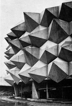 the exterior of an art museum in black and white, with large triangular shapes on it