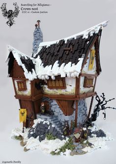 a toy house with snow on the roof