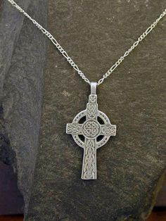 "This Celtic Cross pendant is Sterling Silver. The included chain is a Sterling Silver Figaro 50 chain. You may choose 16, 18 or 20 inch at the same price. Other length available at sightly higher prices. This Celtic Cross pendant measures 1 5/8\" tall by 7/8\" across. I hand cast all my pieces using the lost wax casting method. Please ask your needs. You may call me with questions, often I am out so please use my machine. 831-476-3176. Satisfaction Guaranteed! I send items USPS First Class unle Metal Cross Necklace With Large Pendant, Metal Cross Jewelry With Large Pendant, Symbolic Cross Necklace With Adjustable Chain, Large Metal Cross Pendant Necklace, Symbolic Stainless Steel Cross Pendant Necklace, Lost Wax Casting, Celtic Cross, Lost Wax, Hand Cast