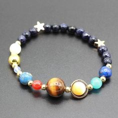 Designed with distinct clarity and elegant color, this Universe Natural Stone Planet Bracelet will bring class and personality to any outfit. Easy to style and wear with everything in your closet, this charming accessory makes a thoughtful gift for any special occasion. Space Bracelet, Success Men, Galaxy Bracelet, Solar System Bracelet, Germany Fashion, French Travel, Star Galaxy, Money Success, Universe Galaxy