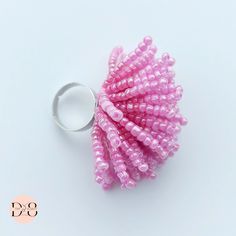 A spectacular Living Ring. Unique. Handmade from 3mm Glass Beads. 2 colors of pink are used, which flow together for a greater effect. The beads are strung on strong nylon thread and sewn to the base of the ring. It rings with your hand and makes a nice sound as the beads touch each other. Weighs 25g The size is adjustable, but note that the smallest diameter is 19,7mm You can match this ring with a set of bracelets in the matching color. Please take a look at my bracelets.  P.S (All items I make come in a special box personally made by me) Handmade Glass Beads, Pink Ring, Ring Unique, Finger Ring, Beaded Rings, Ring Finger, Gift For Mom, Ring Gift, Color Matching