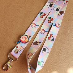 The food in the Kirby series has always looked so cute and delicious!🍭 🍰This lanyard is 2cm wide by 90cm long with a silver lobster clasp and repeating pattern on both sides.   🥪All orders are sent via USPS with tracking after payment has been processed! >Get in Touch with us!< ❥ general info: scarysu.carrd.co/ ❥ art and photos: instagram.com/scarysu.art ❥ twitter hellscape: twitter.com/scarysuart Cute White Lanyards For Gifts, Cute Multicolor Lanyard As A Gift, Cute Multicolor Lanyard For Gifts, Cute Multicolor Lanyards As Gift, Cute Multicolor Lanyard As Gift, Kirby Food, Carrd Co, Cute Lanyard, Cute Lanyards