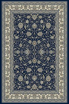 a blue and white rug with an ornate design on the bottom, in front of a black background