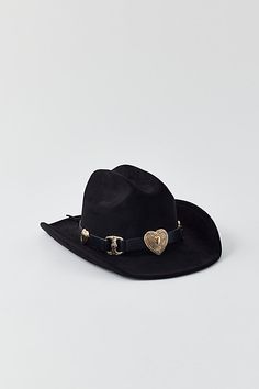 So in love with this cowboy hat in a structured silhouette complete with a heart-topped band. Features Heart cowboy hat Structured cowboy hat Heart accents at the band Lightweight fit and feel Content + Care 100% Polyester Spot clean Imported | Heart Cowboy Hat in Black, Women's at Urban Outfitters Heart Cowboy Hat, Cowgirl Hats, So In Love, Cowboy Hat, Cowboy Hats, Our Wedding, Urban Outfitters, Cowboy, In Love