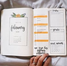 a person is holding an open planner book with the words, calendar and flowers on it