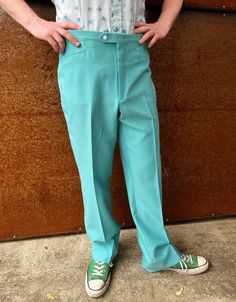 "Classic bright seamfoam blue-green polyester golf pants. Sansa-belt branding with adjustable tabs at side seams on the waistband. Tab over closure. Polyester double knit , some slight stretch. Jet front pockets, welt back pockets. The waistband sits higher on the waist than current pants, so the fit will be different, please see photos.  Great vintage condition. Measured flat in inches Waist 38\" Inseam 33\" Rise 13\" Thigh 26 Leg opening 22\" *My very dear friends across the Sea-there have bee Fitted Summer Pants With Standard Cut Leg, Retro Straight Leg Summer Pants, Retro Full Length Summer Bottoms, 1970s Style Blue Bottoms For Spring, Fitted Blue 1970s Style Bottoms, Retro Green Wide Leg Bottoms, Fitted 1970s Style Blue Bottoms, 1970s Wide Leg Summer Bottoms, 1970s Style Cotton Bottoms For Spring