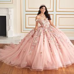 Wow your guests in this stunning Quinceañera gown. Crafted from dreamy glitter tulle, this breathtaking ballgown features sparkling stone accents, shimmering beadwork, and enchanting three-dimensional flowers. The elegant sweetheart neckline and basque waistline are ultra-flattering, while the stunning floral design on the tulle skirt makes a statement that's as unique and unforgettable as you are. Want to switch up your Quinceañera style? Get party ready in an instant by simply removing the sep Aurora Quince, Cotillion Dresses, Pink Quinceanera, Quinceañera Ideas, Pink Quince, Quinceanera Photography, Pink Ball Gown, Quinceanera Dresses Pink, Tulle Balls