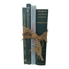 three books are tied together with twine and burlock on each bookcase