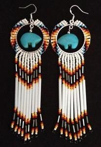 two pairs of earrings with fringes and turquoise stone in the shape of an elephant