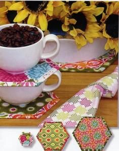 coffee mug and napkins on a table with sunflowers in the background