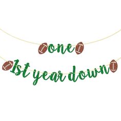 one year down banner with footballs on it