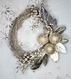 a christmas wreath with silver and white decorations