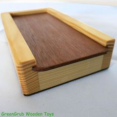 a wooden tray sitting on top of a white table