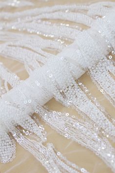 Welcome to Sunny shop. Elegant Couture Lace Fabric For Wedding Dress.Heavy Off-White Beads And Transparent Sequin Lace Fabric, Designer Lace Fabric By The Yard This lace has an amazing look and is really very heavy. It is perfect the the most unique bridal dresses. Width about: 51 inch ( 130 cm) Length : 91 Centimeters/ 1 Yard Yarn: Transparent poly yarn Mesh: Nylon Sequins: YES - Transparent Beads: YES - off-white Color: off-white 8045# Price is set for one yard. You will receive the fabric in White Embroidered Wedding Dress For Party, White Beaded Wedding Dress For Party, White Beaded Sequin Fabric For Party, White Beaded Tulle Fabric For Wedding, White Embellished Organza Embroidered Fabric, White Embellished Embroidered Fabric For Banquet, White Sequined Wedding Dress For Banquet, White Beaded Sequin Fabric For Wedding, White Tulle Fabric With Pearl Embroidery For Party