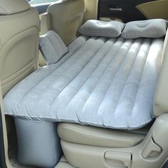 an inflatable car seat with pillows on it