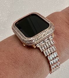 "Fits the Apple Watch available for sizes 38mm 40mm 41mm 42mm 44mm 45mm  Series 2-9 SE.   This is a custom design made to fit the Apple Watch, it is not a brand copy.  This beautiful Custom Apple watch band is high on the bling with a rose gold plated band that features rows of hand set Large Swarovski Crystal Baguette stones.   For the ultimate in sparkle, add the matching  14K Rose Gold Plated Metal Pave Lab Diamond Bezel Cover.  Does not fit the all ceramic watch. This is an Iwatch Candy Excl Luxury Rose Gold Rectangular Apple Watch Band, Apple Watch Cover, Apple Watch Band Women, Custom Apple Watch Bands, Apple Watch Bands Women, Rose Gold Apple Watch, Gold Apple Watch, Apple Watch Series 2, Gold Apple