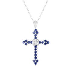 "Featuring illuminating round-cut gemstones and diamond accents, this sterling silver cross pendant offers divine style. Featuring illuminating round-cut gemstones and diamond accents, this sterling silver cross pendant offers divine style. NECKLACE DETAILS Pendant size: 1 1/16"" x 3/4"" Chain length: 18"" Chain type: cable Clasp: spring-ring Metal: sterling silver Packaging: boxed Additional details: nickel freeSTONE DETAILS Total weight: 9/10 ct. Setting: prongDIAMOND DETAILS Total weight: les Blue Cross Pendant Necklace For Anniversary, Blue Gemstone Cross-shaped Jewelry, Blue Cross Jewelry For Anniversary, Blue Sterling Silver Cross Pendant Necklace, Blue Sterling Silver Crucifix Jewelry, Sterling Silver Cross Pendant, Steel Cross, Silver Cross Pendant, Symbolic Jewelry