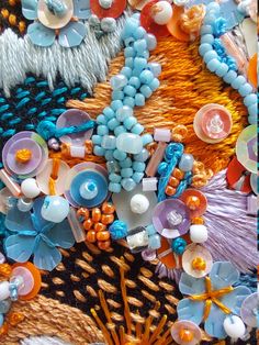 an assortment of beads and other items on display