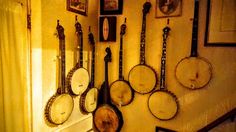 there are many pans hanging on the wall