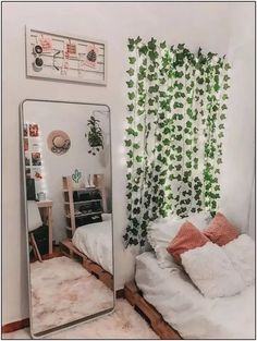 a bedroom with a bed, mirror and plants on the wall