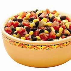 a yellow bowl filled with corn and black beans