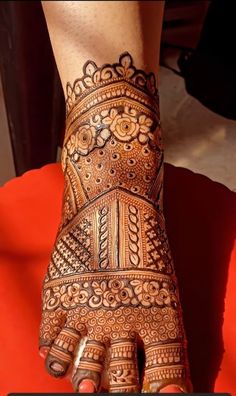 a woman's hand with hennap on it, showing the intricate design