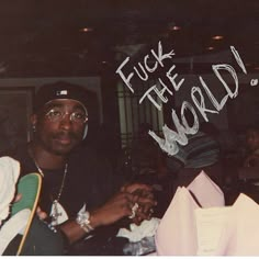 a man sitting at a table with papers and napkins