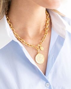 The Peruvian Coin Toggle Necklace embodies the rich history of Peruvian gold and the beauty that comes with individuality. Created with a 17th-century Peruvian gold-cob coin set on our ever-popular textured toggle chain, the Peruvian Coin Toggle Necklace will go with everything. Medallion Toggle Necklace With Coin Pendant As Gift, Elegant Toggle Necklace With Round Coin Pendant, Toggle Necklace With Coin Pendant, Elegant Toggle Necklace With Coin Pendant, Gold Toggle Necklace With Coin Pendant, Gold-plated Tarnish-resistant Toggle Necklace, Luxury Tarnish-resistant Coin Necklace For Women, Luxury Gold-tone Toggle Necklace For Women, Gold Coin Ring