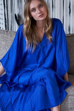 Home or away, let the professional lounging commence. Blue Relaxed Fit V-neck Tunic, Blue Spring Tunic For Loungewear, Blue Oversized Kaftan For Loungewear, Oversized Blue Kaftan For Loungewear, Blue V-neck Kaftan For Loungewear, Chic Blue Tunic Kaftan, Chic Blue Long Sleeve Kaftan, Blue Tunic With Kimono Sleeves, Blue Kimono Sleeve Loungewear Dress