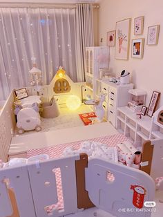 a child's room is decorated in pink and white