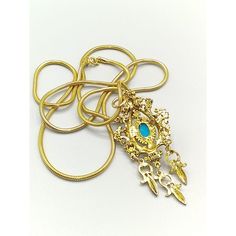 Vintage Celebrity Necklace, Faux Turquoise Cabochon and Red Crystal, Ottoman Pendant with Gold Tone Dangles on Golden Snake Chain Measurement * 34″ with 3″ x 1-1/4″ pendant Condition * Excellent condition. Gently worn. Ornate Pendant Necklaces With Charms, Ornate Pendant Necklace With Charms, Gold Turquoise Costume Jewelry Necklace For Gift, Gold Turquoise Necklace Costume Jewelry For Gift, Celebrity Necklace, Golden Snake, Red Crystals, Snake Chain, Ottoman