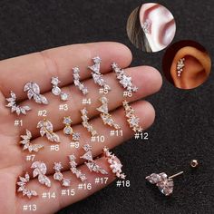 six pairs of ear piercings in different styles and sizes, including one with crystal stones