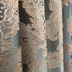 curtains with gold and blue lace on them