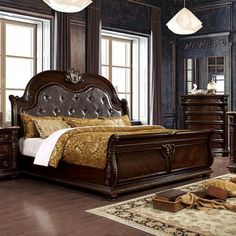 a bedroom scene with focus on the bed and dresser